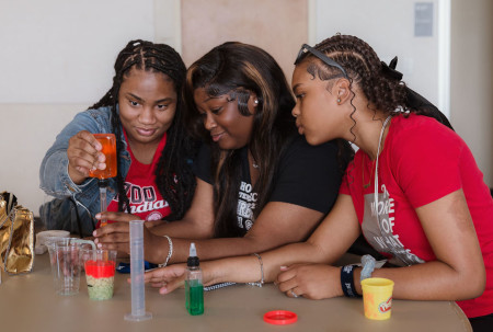 Students doing science experiments at STEM camp