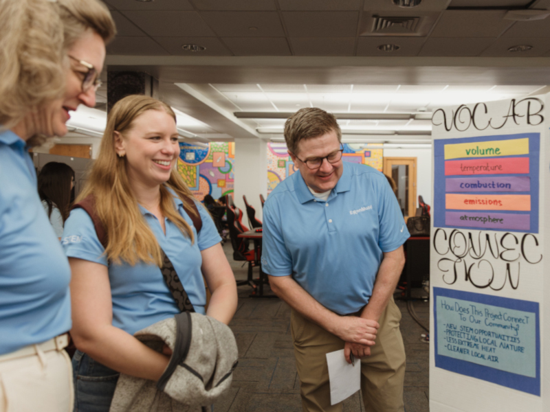 ExxonMobil volunteers looking at presentations