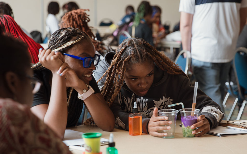Students building reservoirs