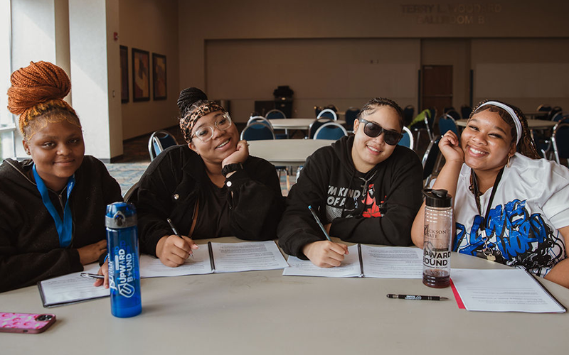 Students smiling at camera