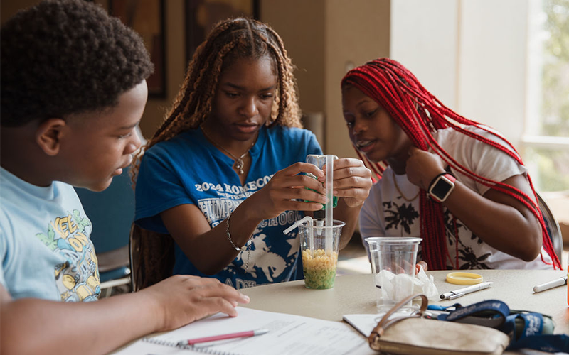 Students building reservoirs