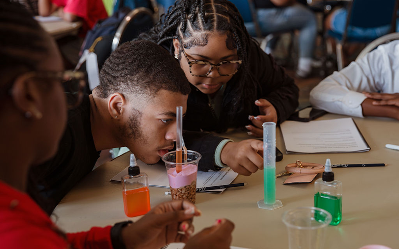 Students building reservoirs