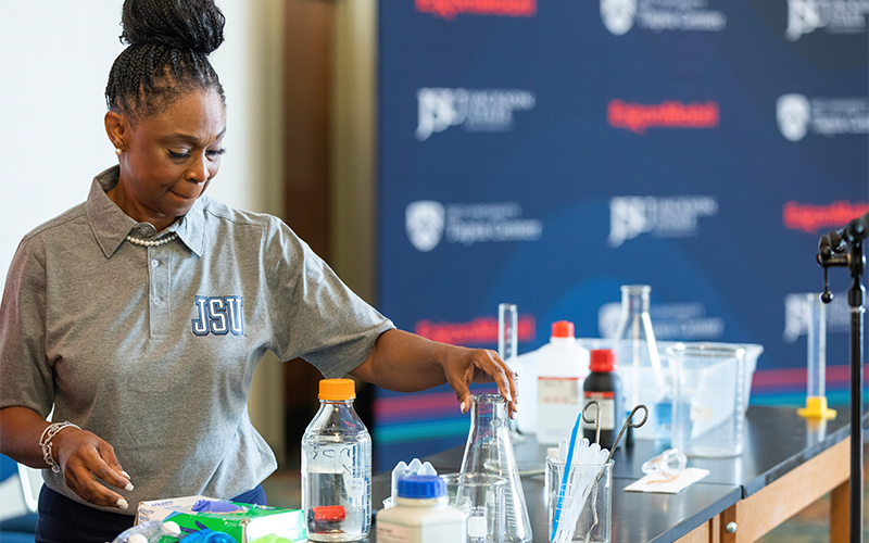 Dr. Jones Gregory setting up experiment