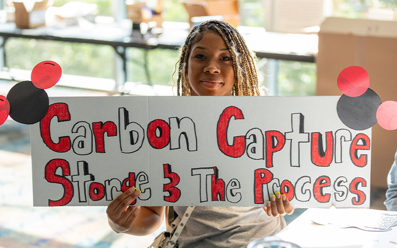 Students working on posters