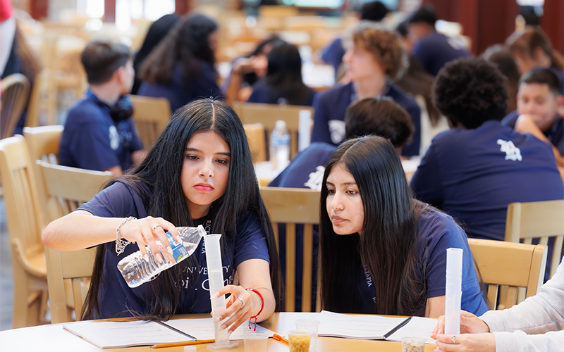 Students building reservoirs
