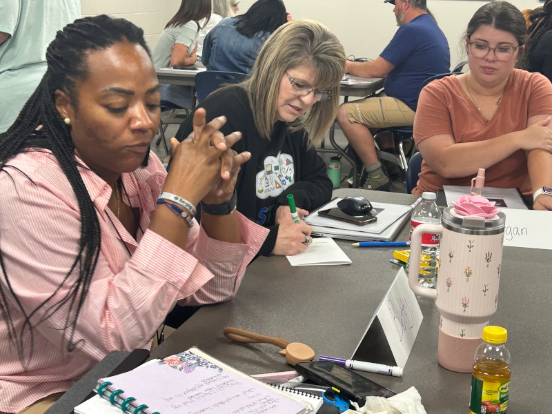 Educators working on projects