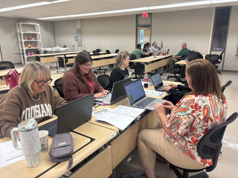 Educators working on projects