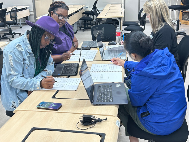 Educators working on projects