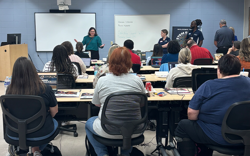 Educators listening to presentations