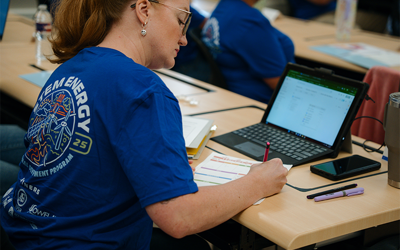 Educator taking notes