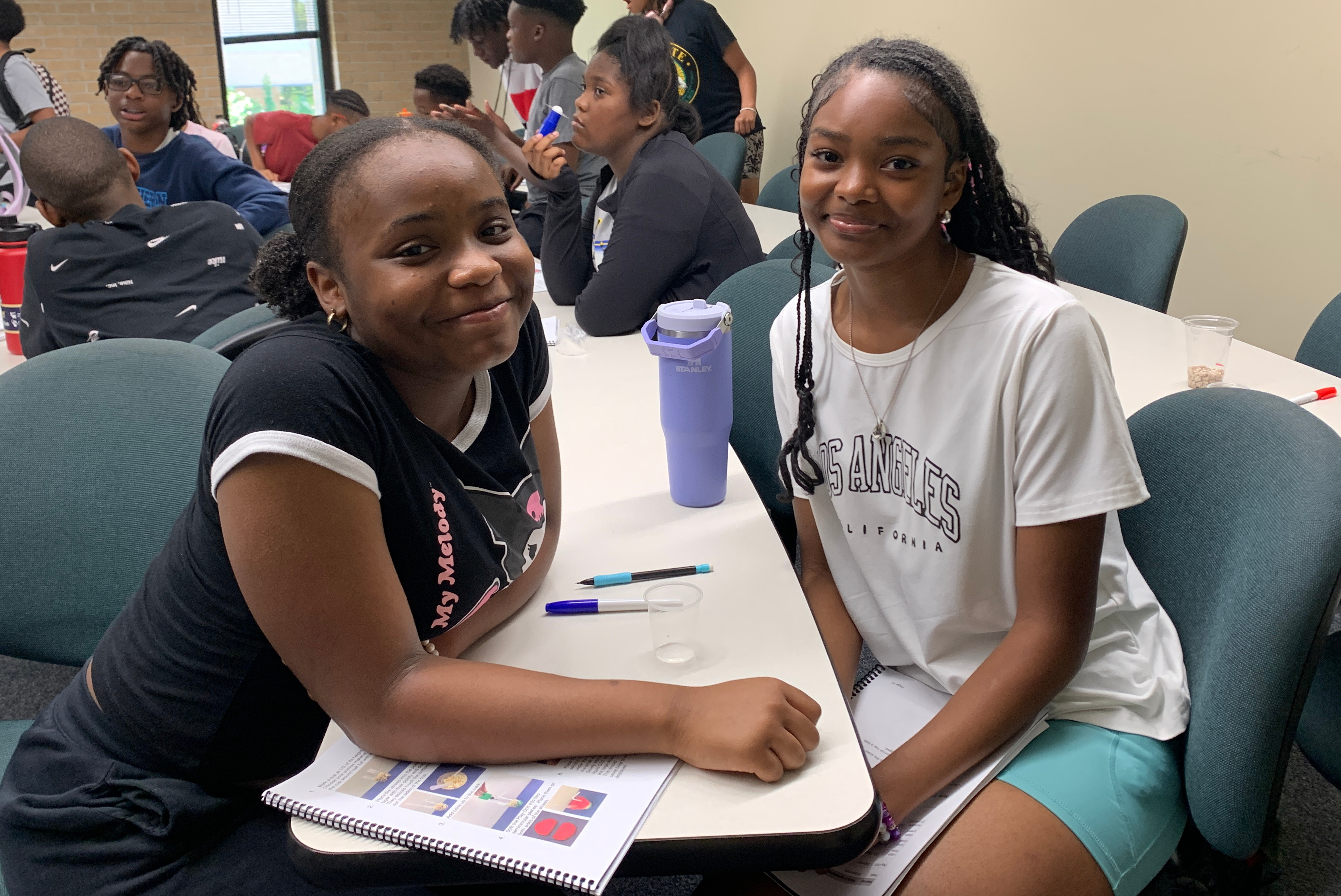 Students doing science experiments at STEM camp