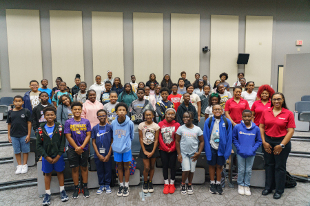 Students taking photo with ExxonMobil representatives