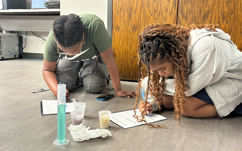 Students building reservoirs